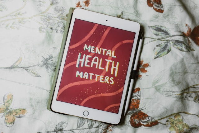 An iPad with the words Mental Health Matters on the screen.