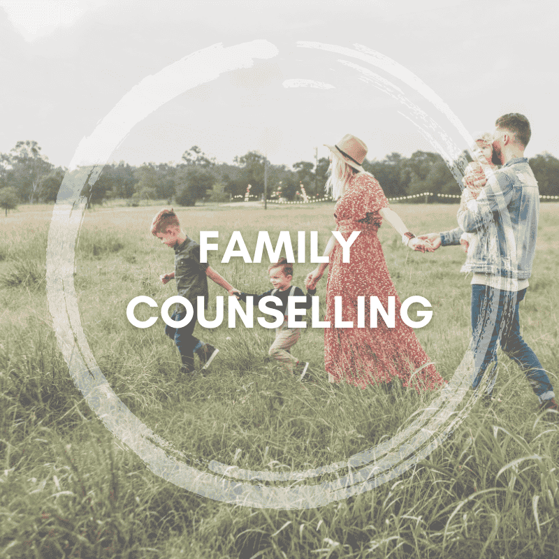 Family walking together in a field, symbolizing unity and support through family counselling services