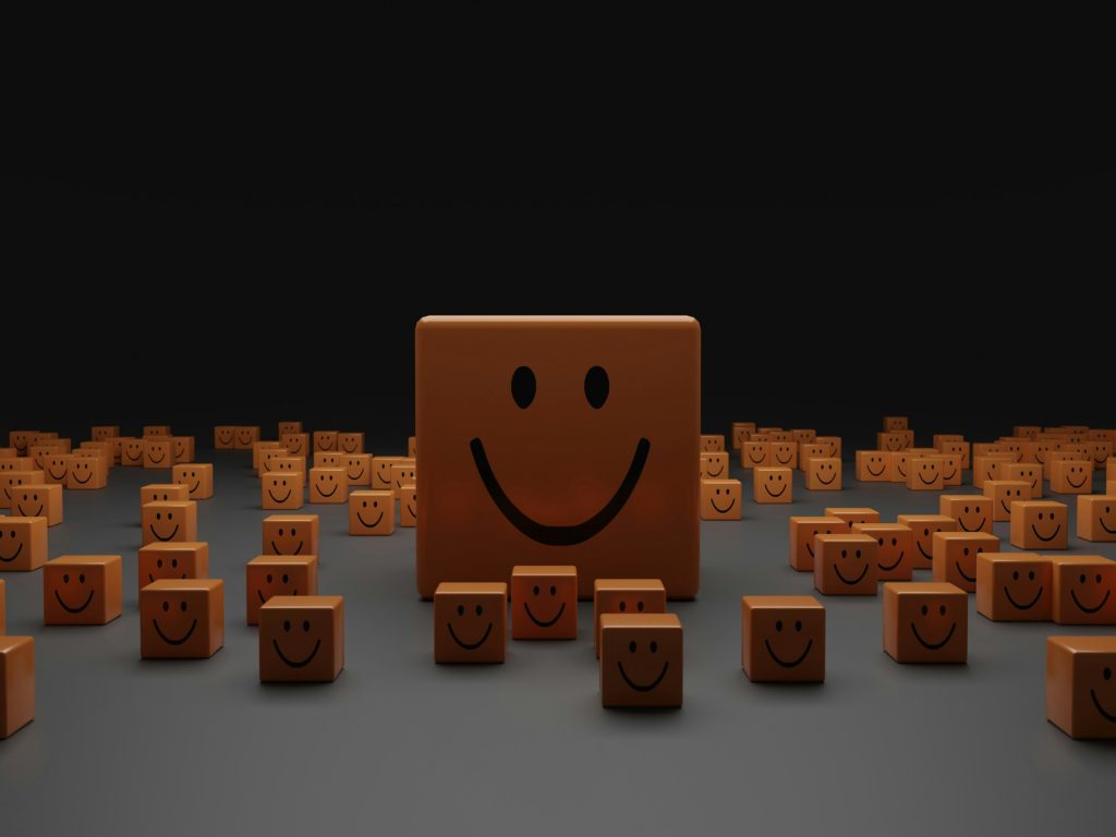 Wooden blocks with smiley faces.